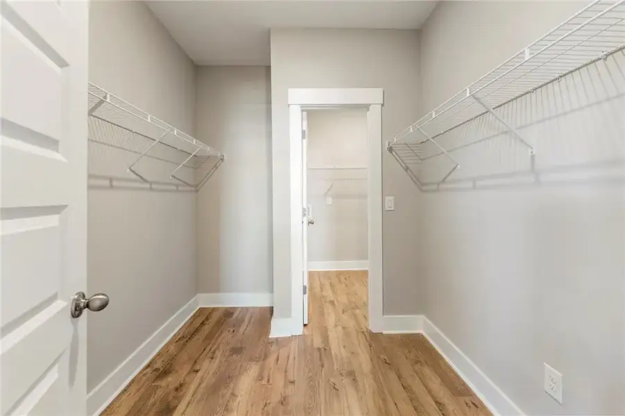 Ample shelving in this walk-in closet offers exten