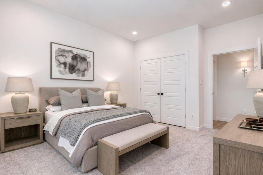 Another secondary bedroom showcases its spacious layout and bright, airy feel. The room offers ample wall space for furniture placement and décor, while the nearby doorway provides easy access to the rest of the home. With its neutral palette and comfortable design, this space is ready to be personalized. This photo is virtually staged.