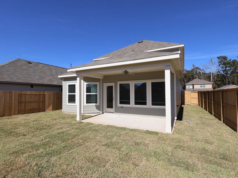 Exterior details and patio area of a home in Pinewood at Grand Texas, New Caney (Image 2).