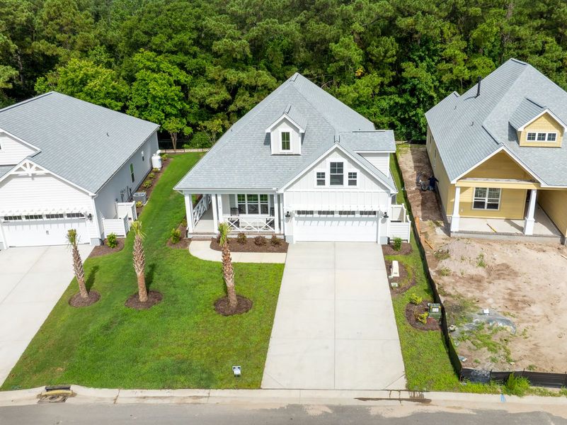 Front exterior of a new home in The Sanctuary at Sunset Beach, Sunset Beach, NC, highlighting curb appeal (Image 27).