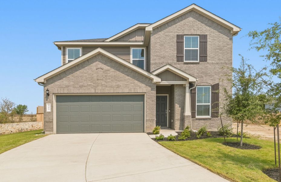 Front exterior of a new home in Patterson Ranch, Georgetown, TX, highlighting curb appeal (Image 21).