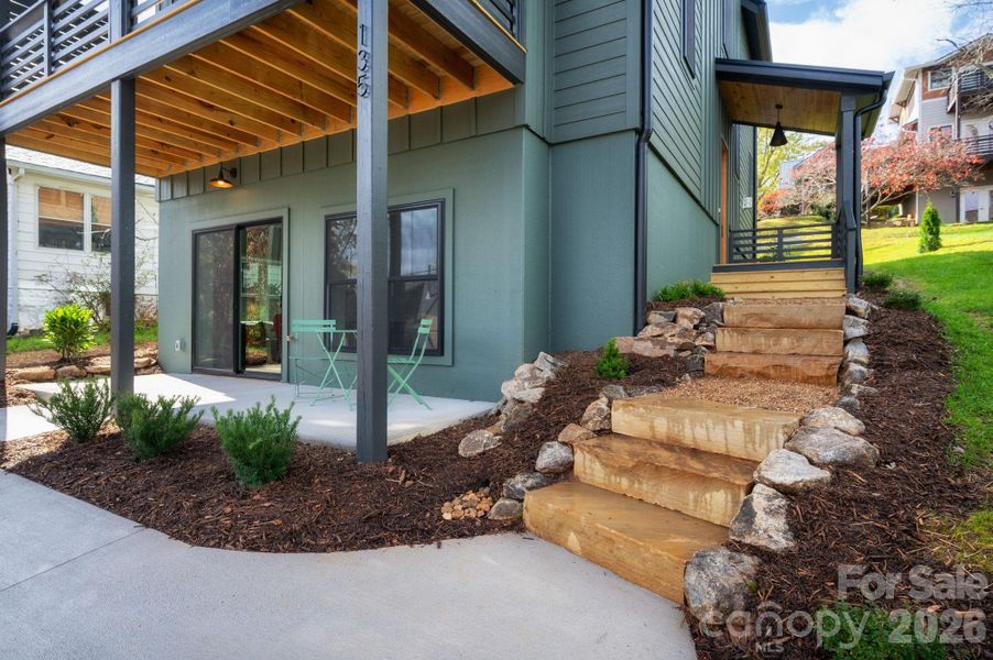 Basement Level Patio and Stone Steps to Main Entry