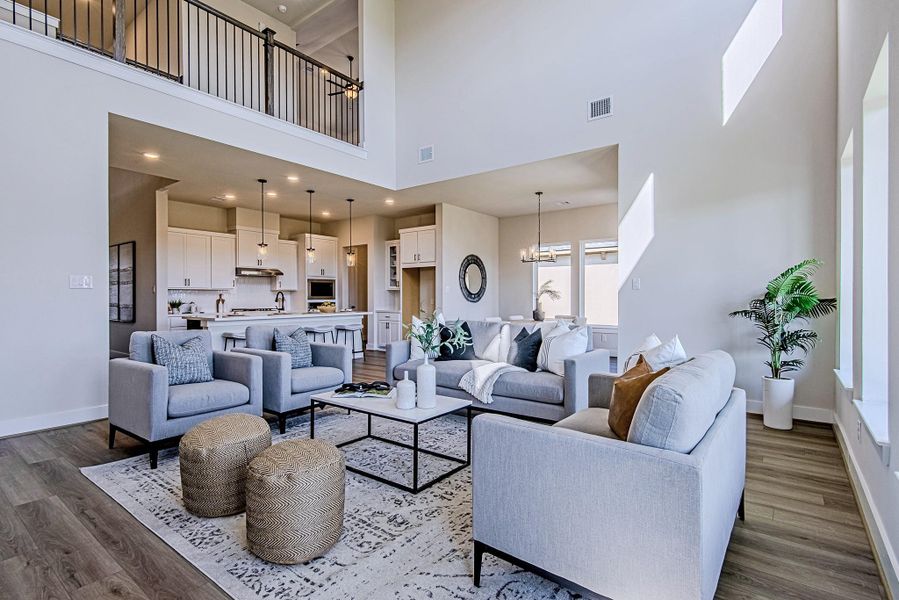 Open living room with high ceilings and a seamless connection to the kitchen