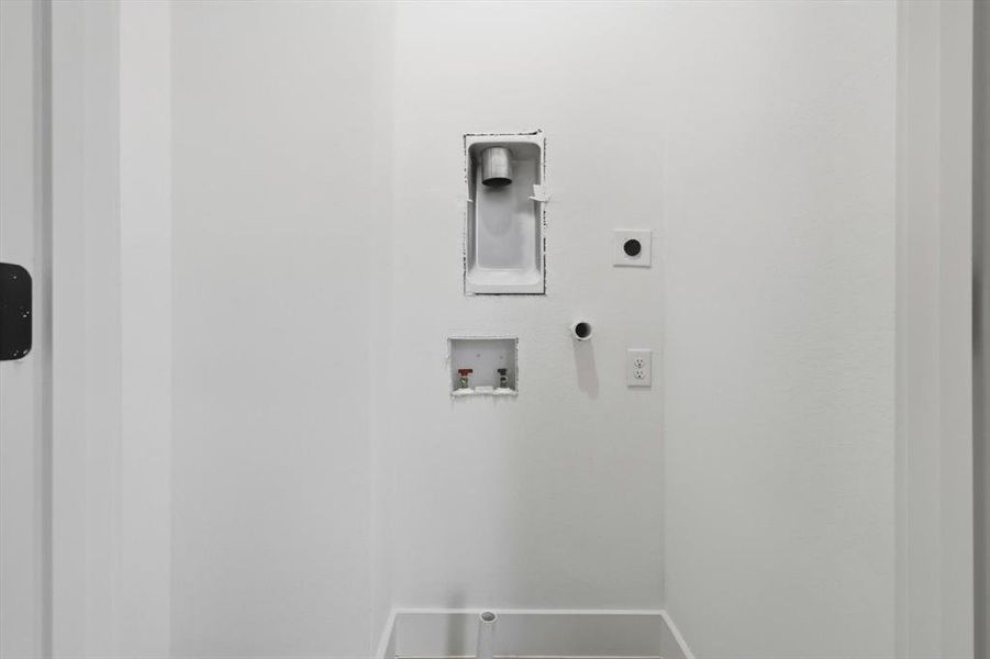 Laundry room featuring washer hookup, electric dryer hookup, and hookup for a gas dryer Laundry room featuring washer hookup, electric dryer hookup, and hookup for a gas dryer