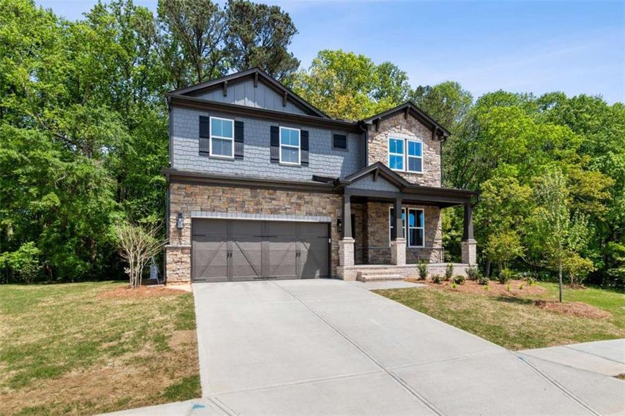 Front exterior of a new home in The Paddocks at Doc Hughes, Buford, GA, highlighting curb appeal (Image 2). Front exterior of a new home in The Paddocks at Doc Hughes, Buford, GA, highlighting curb appeal (Image 2).