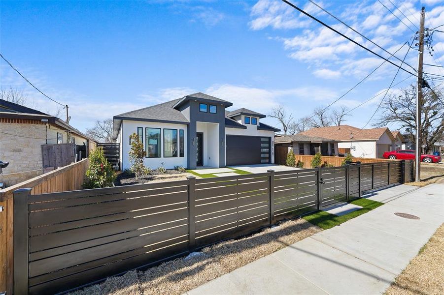 Front exterior of a new home in , Dallas, TX, highlighting curb appeal (Image 21).