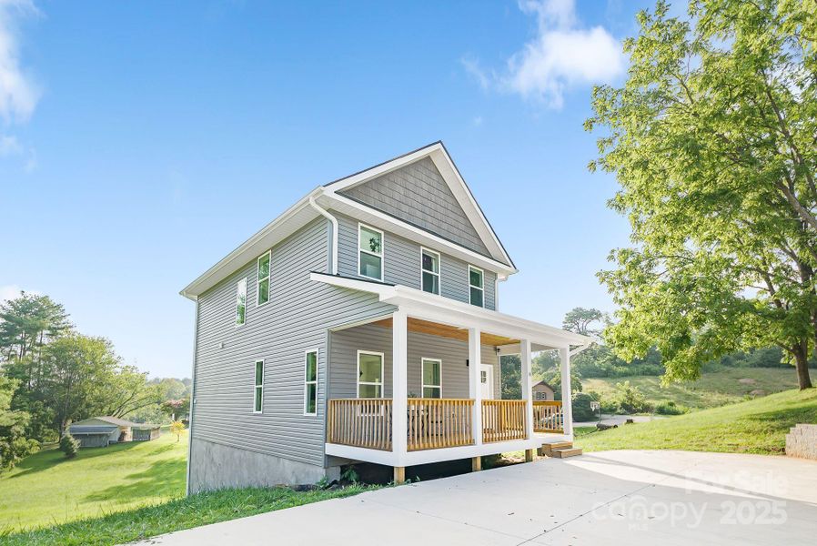 Front exterior of a new home in , Asheville, NC, highlighting curb appeal (Image 1).