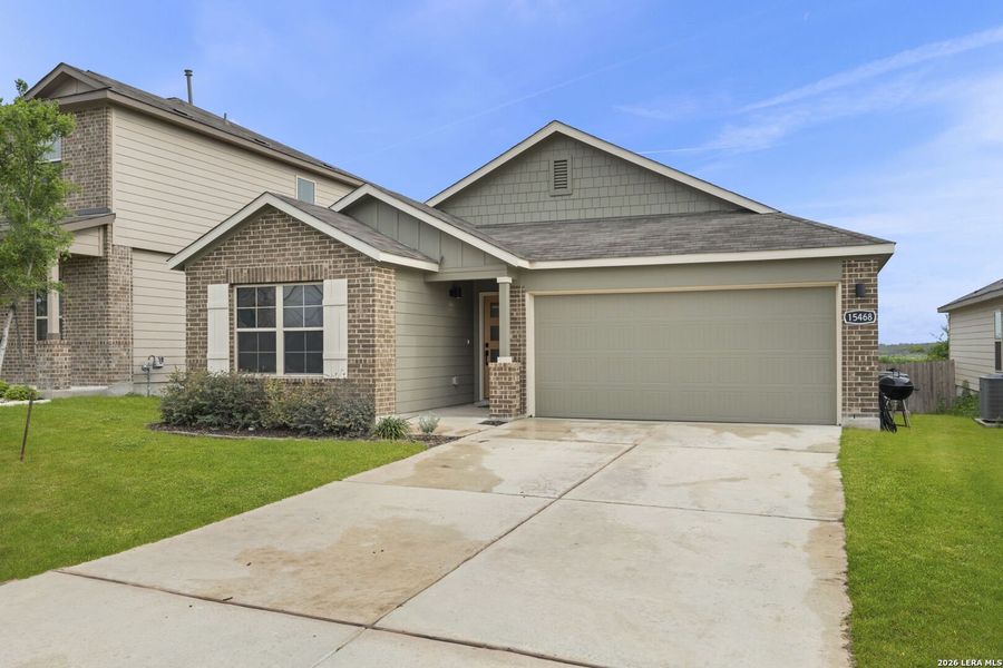 Front exterior of a new home in Hunters Ranch, San Antonio, TX, highlighting curb appeal (Image 1). Front exterior of a new home in Hunters Ranch, San Antonio, TX, highlighting curb appeal (Image 1).