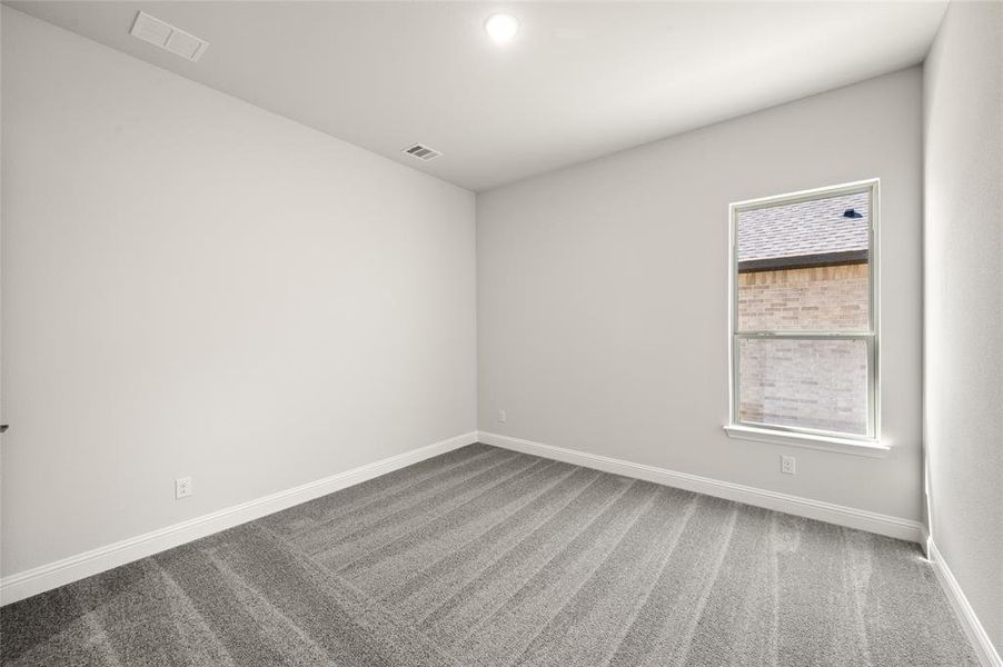 Bedroom #3 with spacious closet and upgraded carpet Bedroom #3 with spacious closet and upgraded carpet