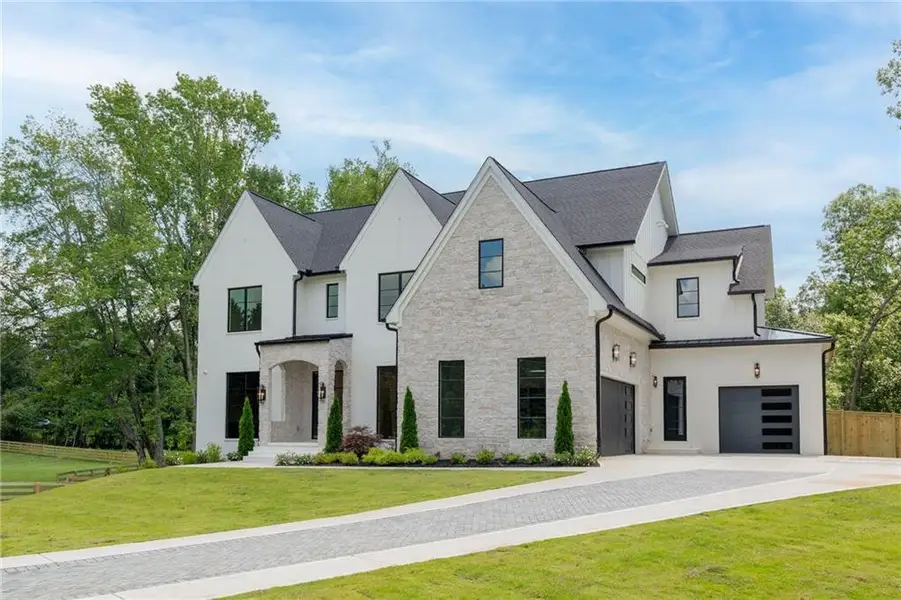 Front exterior of a new home in , Alpharetta, GA, highlighting curb appeal (Image 29). Front exterior of a new home in , Alpharetta, GA, highlighting curb appeal (Image 29).