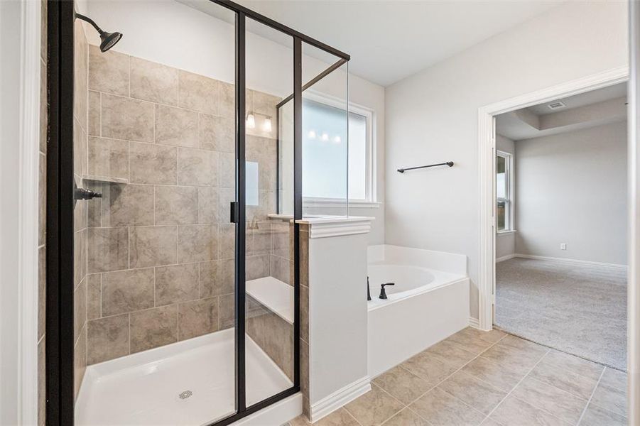 Full bathroom with a garden tub, a shower stall, and tile patterned flooring Full bathroom with a garden tub, a shower stall, and tile patterned flooring