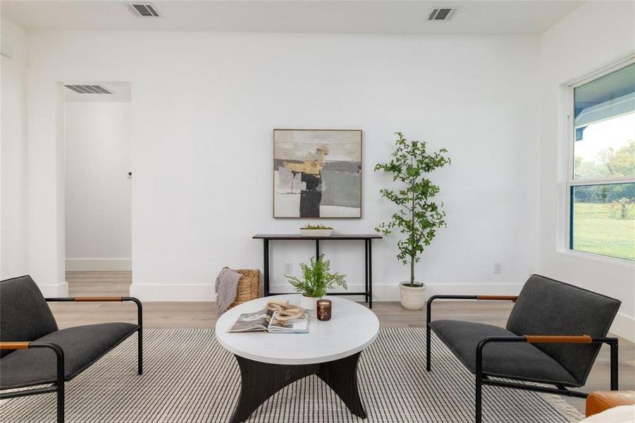 Living area featuring light wood-type flooring