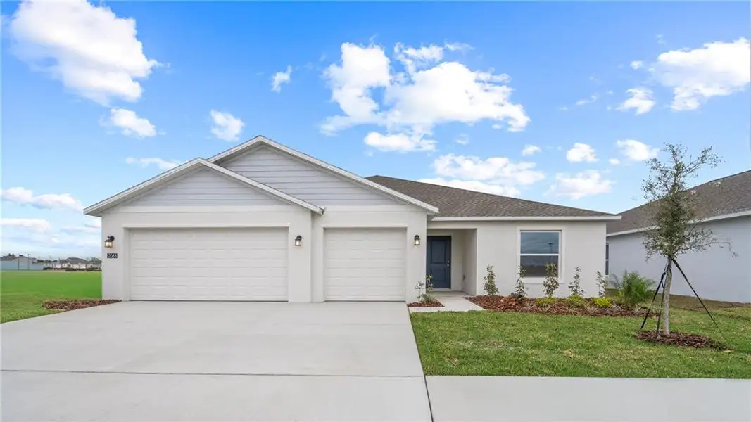 Front exterior of a new home in , Eagle Lake, FL, highlighting curb appeal (Image 2). Front exterior of a new home in , Eagle Lake, FL, highlighting curb appeal (Image 2).