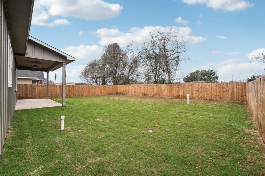 View of yard with a patio area, ceiling fan, and a fenced backyard View of yard with a patio area, ceiling fan, and a fenced backyard