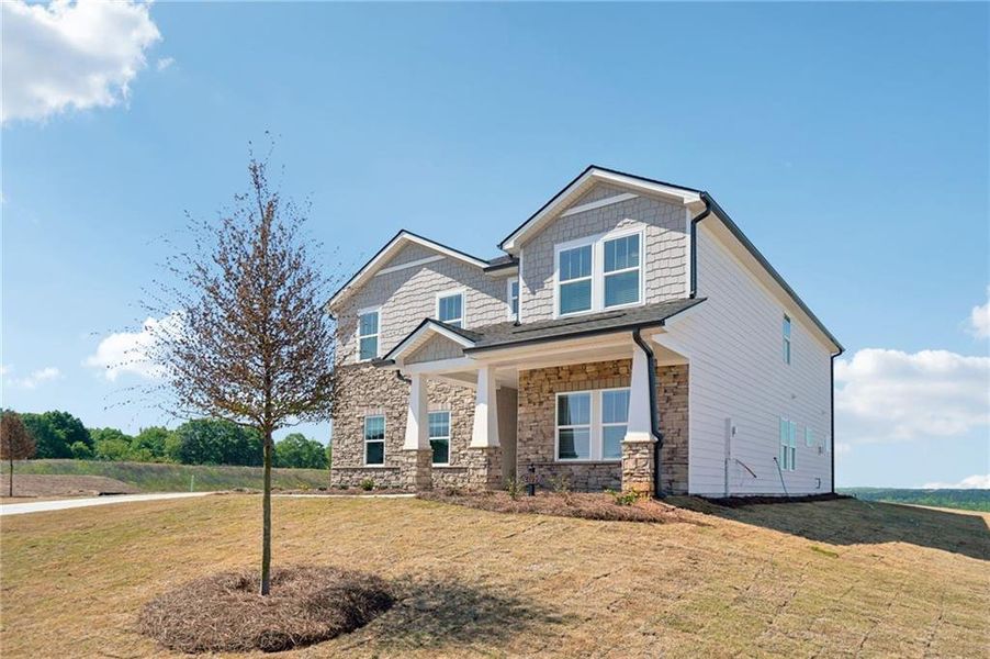 Front exterior of a new home in River Pointe, Monroe, GA, highlighting curb appeal (Image 25).