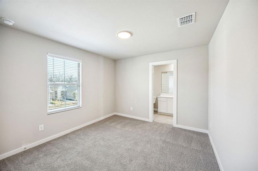 Bedroom in the Willow home plan by Trophy Signature Homes – REPRESENTATIVE PHOTO