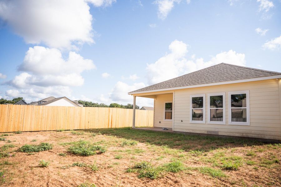 Front exterior of a new home in , Smithville, TX, highlighting curb appeal (Image 20). Front exterior of a new home in , Smithville, TX, highlighting curb appeal (Image 20).
