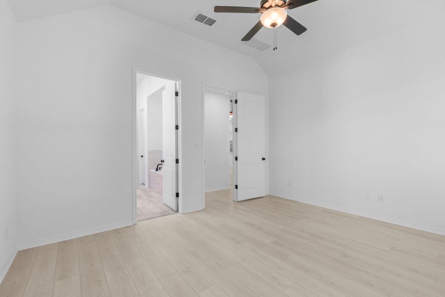 Primary Bedroom with elevated ceiling