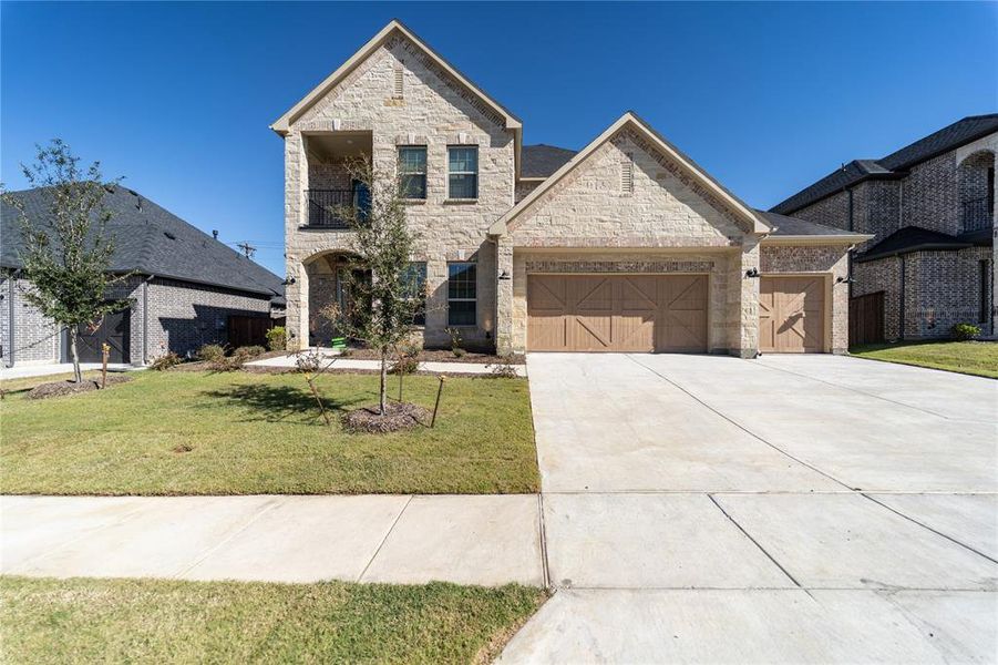 Front exterior of a new home in Sonoma Verde, Rockwall, TX, highlighting curb appeal (Image 2).