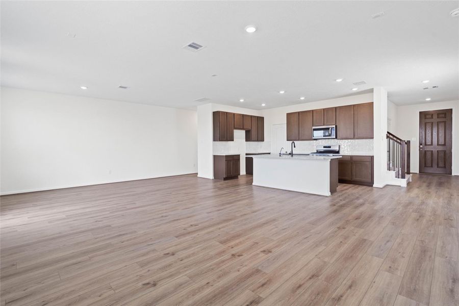 Stunning open-concept design seamlessly connecting the living, dining, and kitchen areas—perfect for both everyday living and entertaining! Stunning open-concept design seamlessly connecting the living, dining, and kitchen areas—perfect for both everyday living and entertaining!