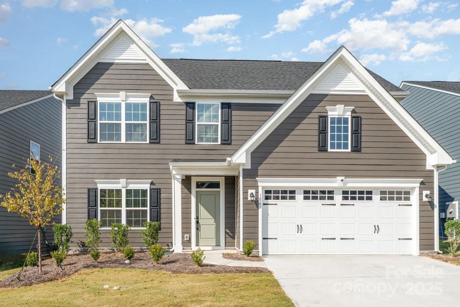 Front exterior of a new home in , Monroe, NC, highlighting curb appeal (Image 1).