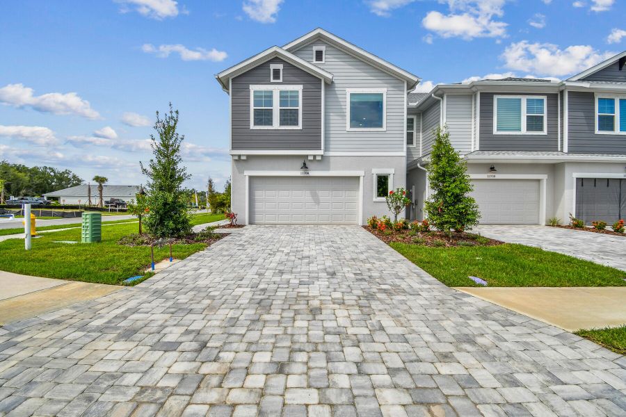 Front exterior of a new home in North River Ranch – Townhomes, Parrish, FL, highlighting curb appeal (Image 2).