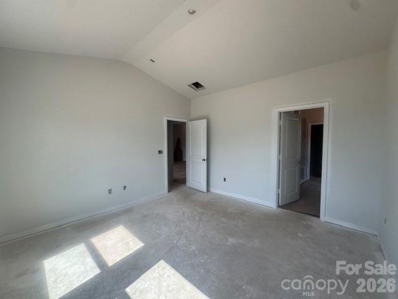 Primary Bedroom with vaulted ceilings