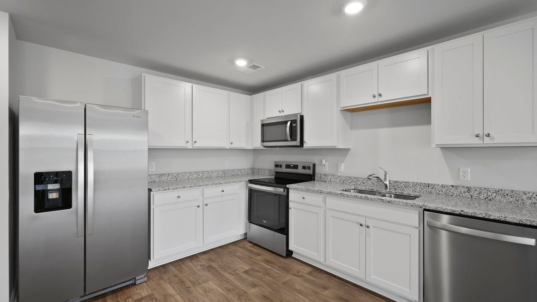Representative furnished interior of a home built from the SULLIVAN by D.R. Horton in Center Pointe, Santee (Image 4).