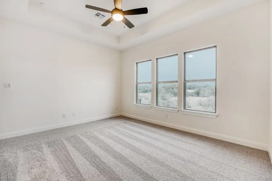 Spacious, unfurnished interior of a new home in 6 Creeks, Kyle (Image 7).