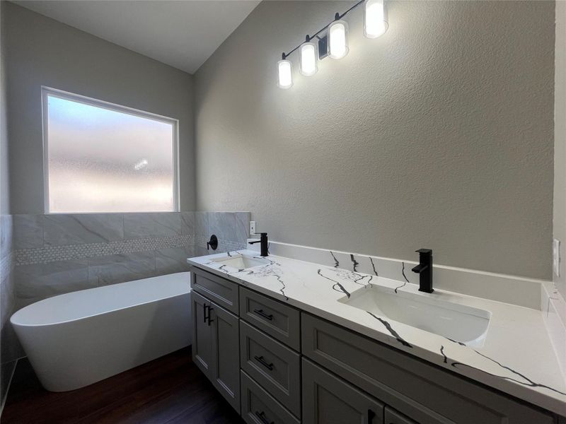28811 Champion Oaks double vanity and free standing tub in primary bathroom 28811 Champion Oaks double vanity and free standing tub in primary bathroom