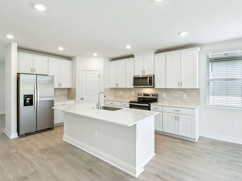 Furnished interior view inside a new home in The Reserve at Hammock Oaks - Signature Series, Lady Lake (Image 7).