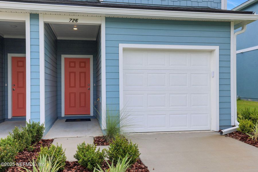 Front exterior of a new home in Kasen Oaks, Jacksonville, FL, highlighting curb appeal (Image 16).