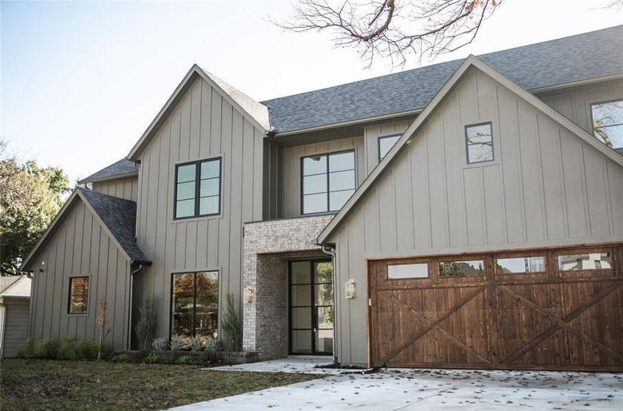 Modern inspired farmhouse with a garage