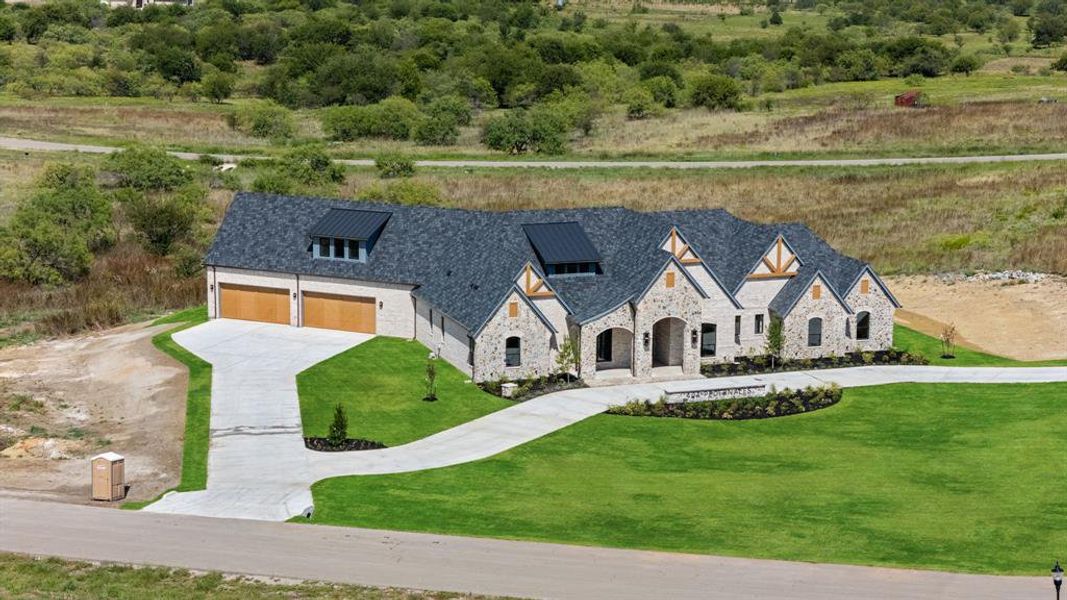 Front exterior of a new home in , Aledo, TX, highlighting curb appeal (Image 22). Front exterior of a new home in , Aledo, TX, highlighting curb appeal (Image 22).