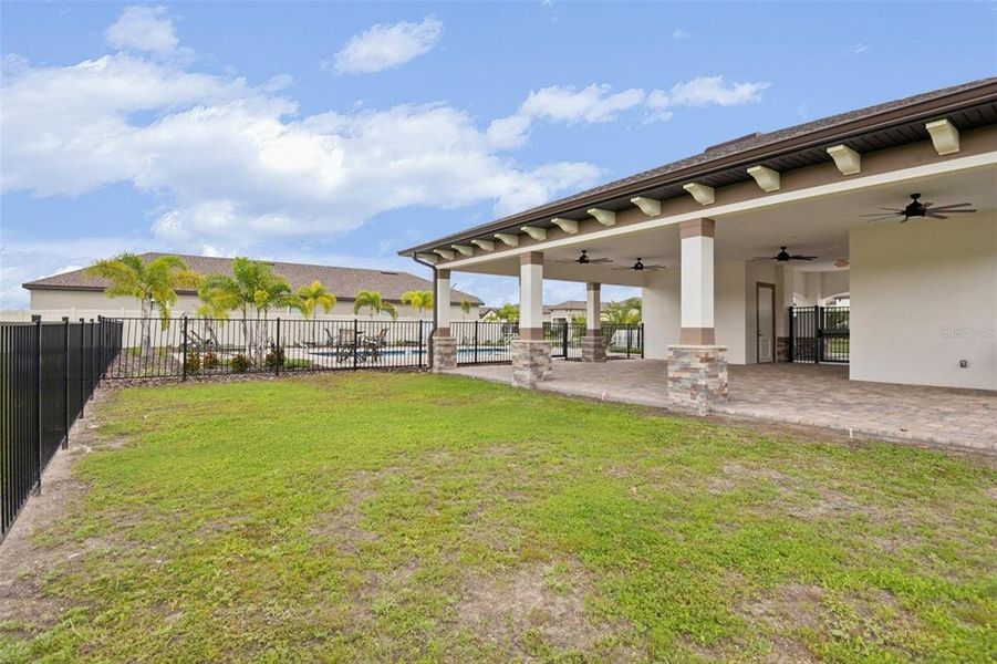 Exterior details and patio area of a home in Grasslands West, Lakeland (Image 21).