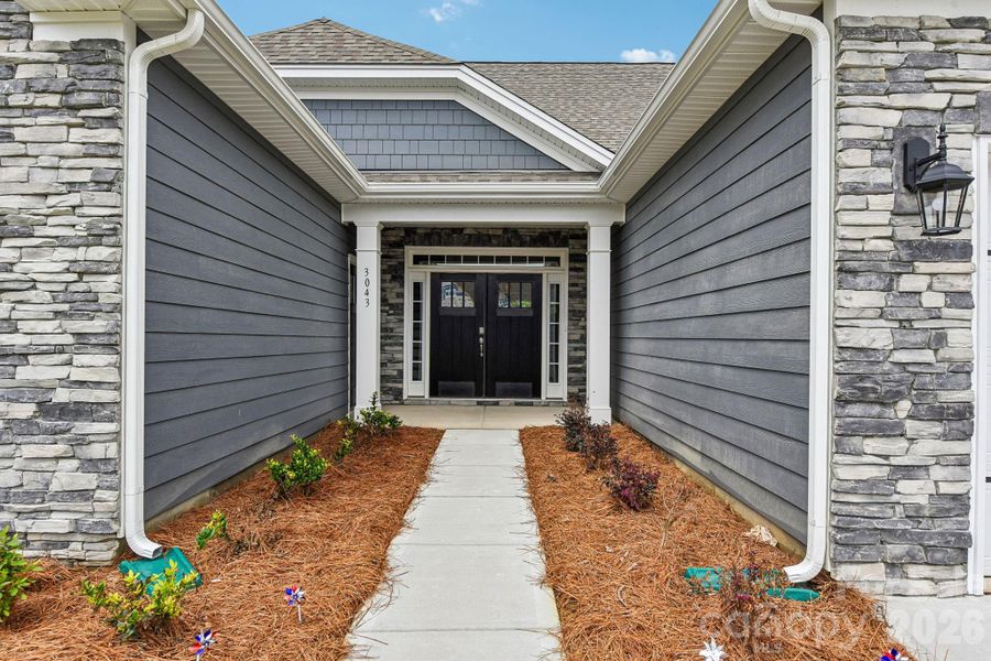 Exterior details and patio area of a home in Sanctuary at Southgate, Indian Trail (Image 3).