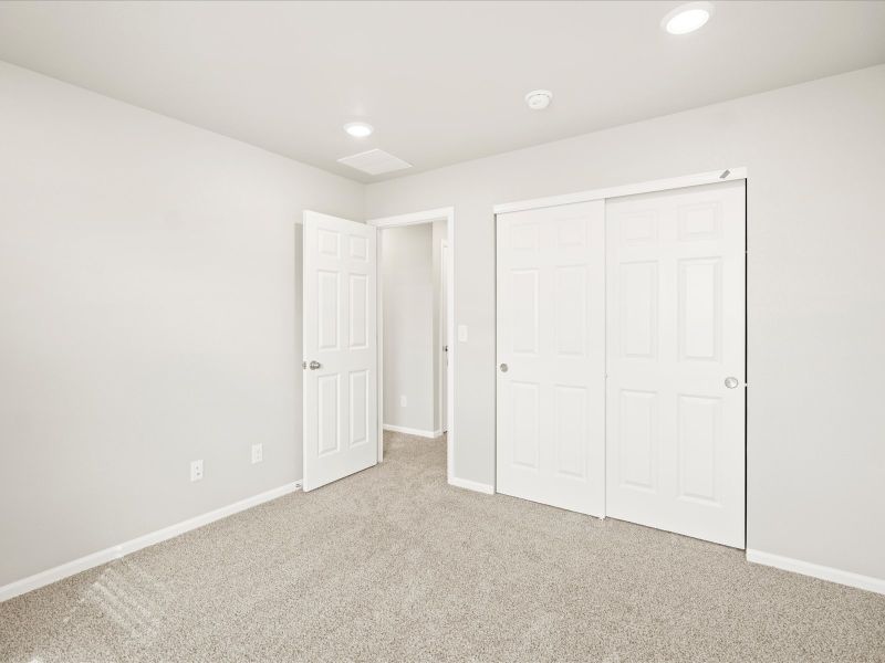 Spacious, unfurnished interior of a new home in Buffalo Highlands: The Flora Collection, Commerce City (Image 13).