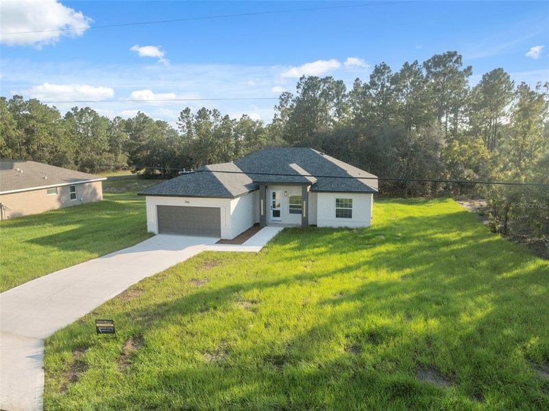 Front exterior of a new home in , Ocala, FL, highlighting curb appeal (Image 21).