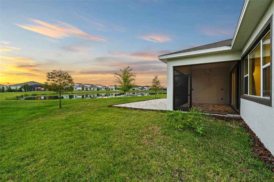Exterior details and patio area of a home in Robin's Cove at Epperson, Wesley Chapel (Image 28).