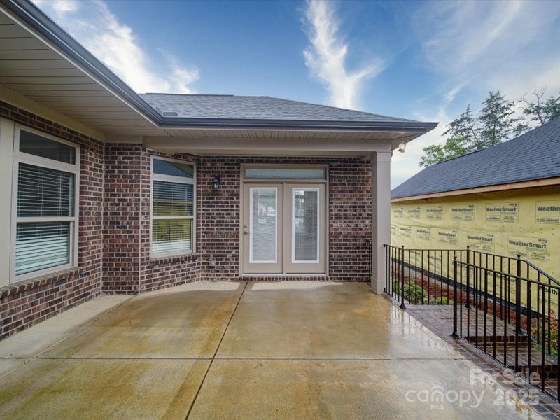 Exterior details and patio area of a home in The Courtyards on New Hope, Gastonia (Image 21).