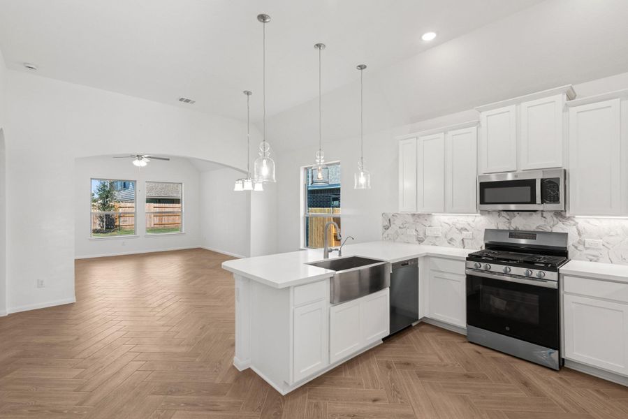 Kitchen open to the dining area (*Photo not of actual home and used for illustration purposes only.)