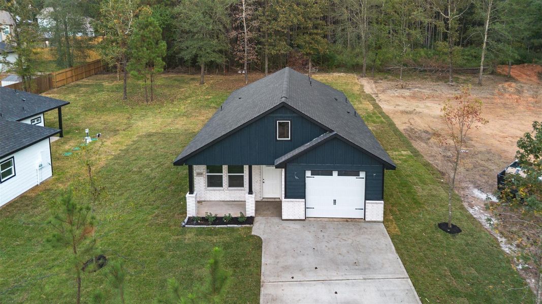 Front exterior of a new home in , Willis, TX, highlighting curb appeal (Image 8). Front exterior of a new home in , Willis, TX, highlighting curb appeal (Image 8).