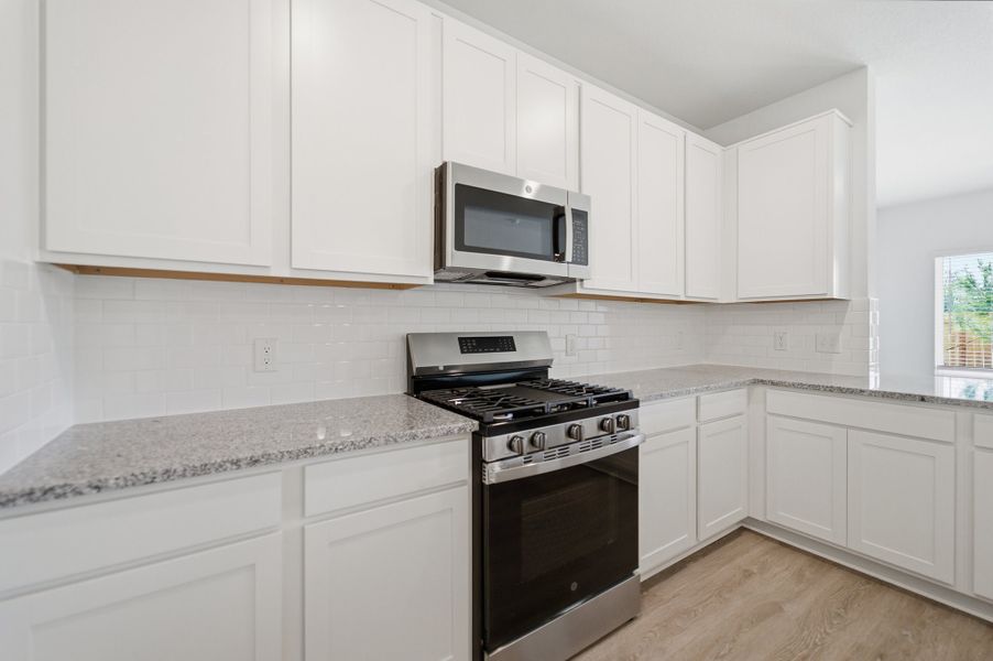 Furnished interior view inside a new home in The Pines at Seven Coves, Willis (Image 10).