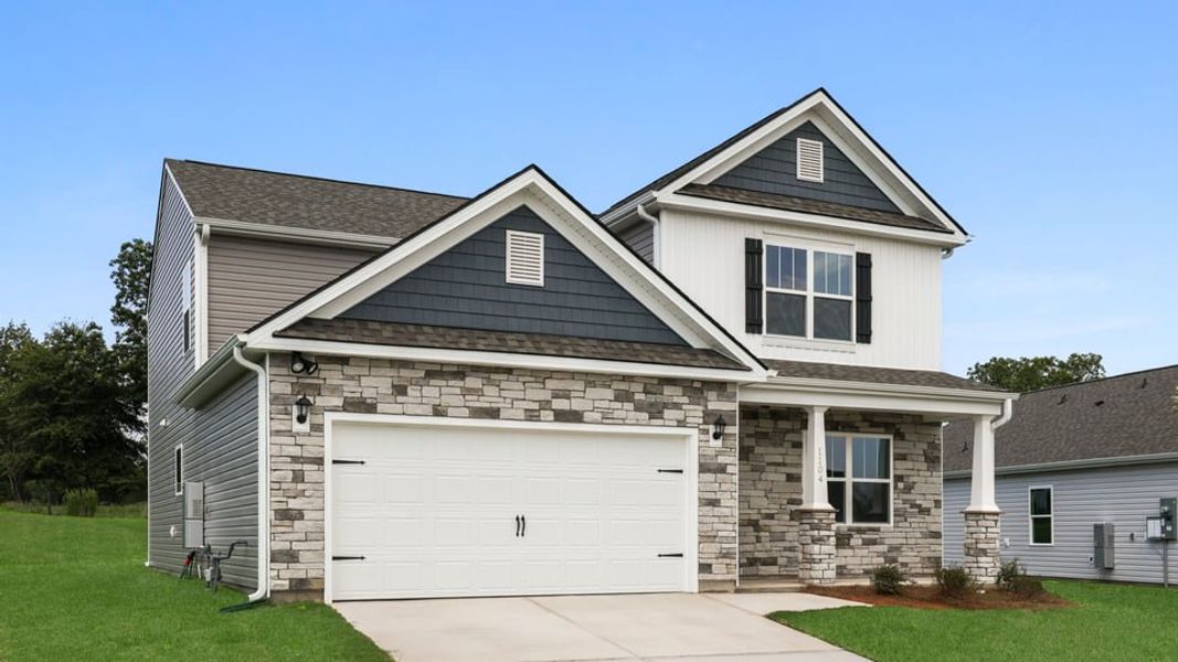 Front exterior of a new home in Benjamin's Grove, Woodruff, SC, highlighting curb appeal (Image 2). Front exterior of a new home in Benjamin's Grove, Woodruff, SC, highlighting curb appeal (Image 2).