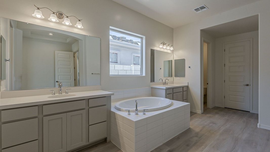 Furnished interior view inside a new home in Windrose, Waddell (Image 30).