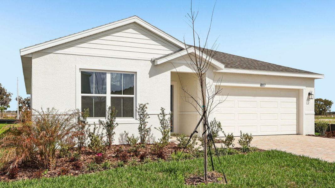 Representative exterior photo of a completed home built from the Baker by DRB Homes in Hamilton Bluff, Haines City, FL (Image 25).
