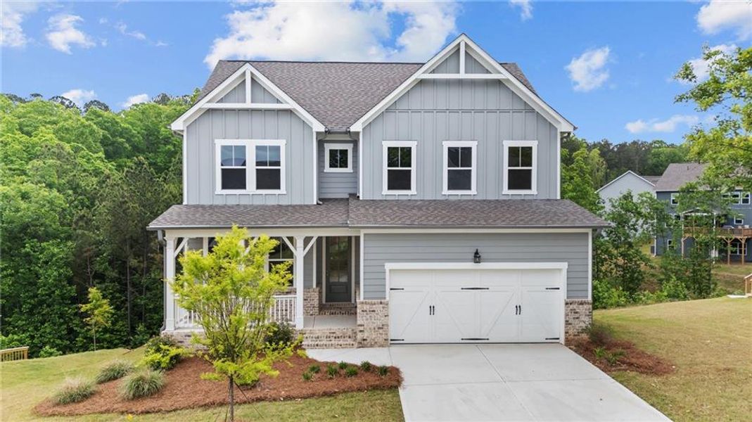 Front exterior of a new home in Riverwood, Dallas, GA, highlighting curb appeal (Image 1). Front exterior of a new home in Riverwood, Dallas, GA, highlighting curb appeal (Image 1).