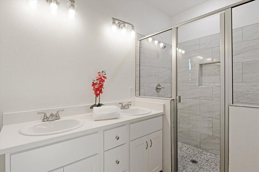 Bathroom with vanity and an enclosed shower