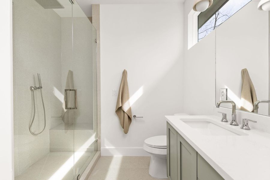 Bathroom featuring vanity and a stall shower Bathroom featuring vanity and a stall shower