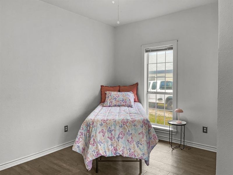 Bedroom #3 featuring dark wood-style floors